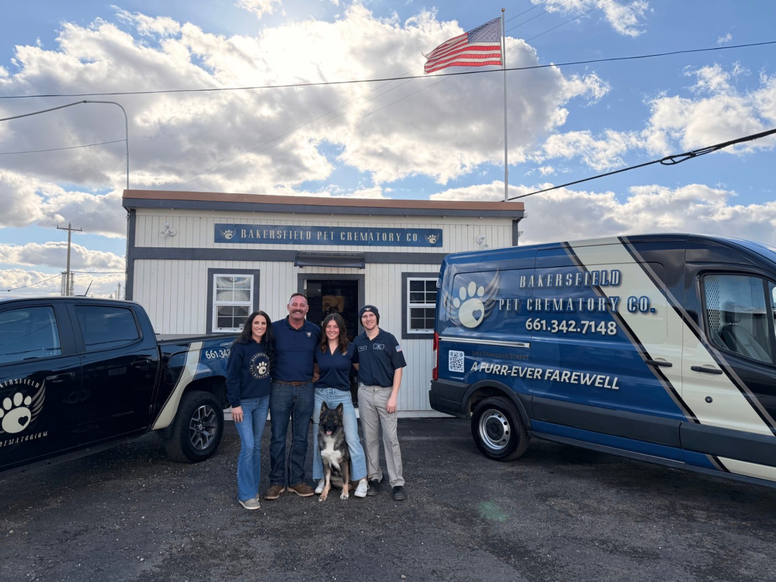 The Bakersfield Pet Crematory team standing in front of their facility and service vehicles in Bakersfield, CA.